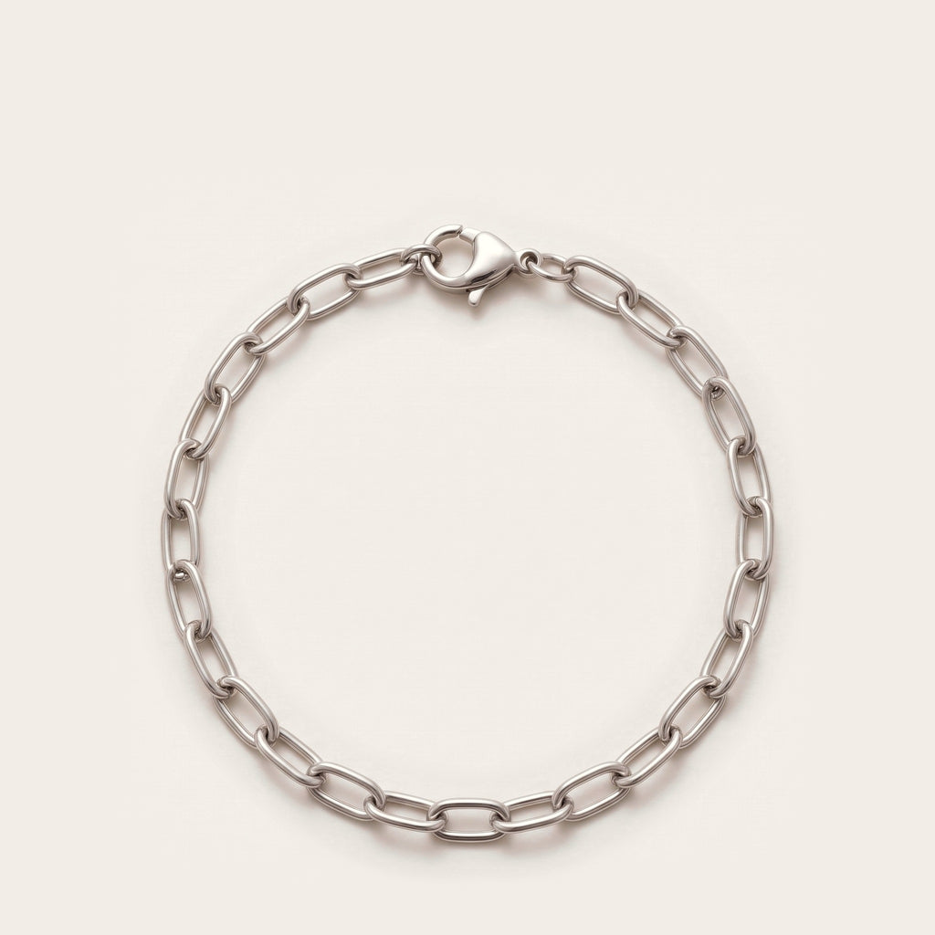 Silver elongated cable chain bracelet on bone