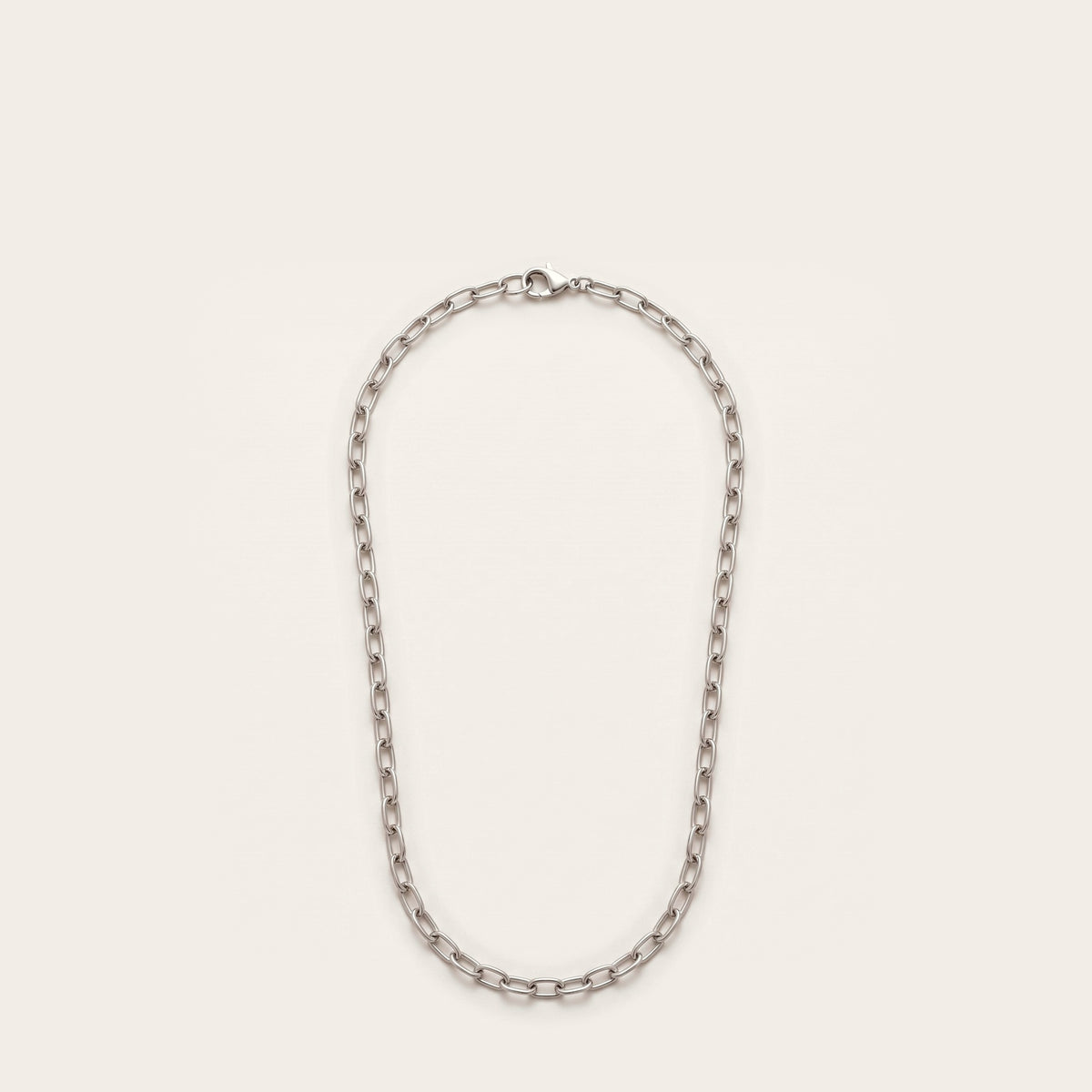 Silver elongated cable chain necklace on bone